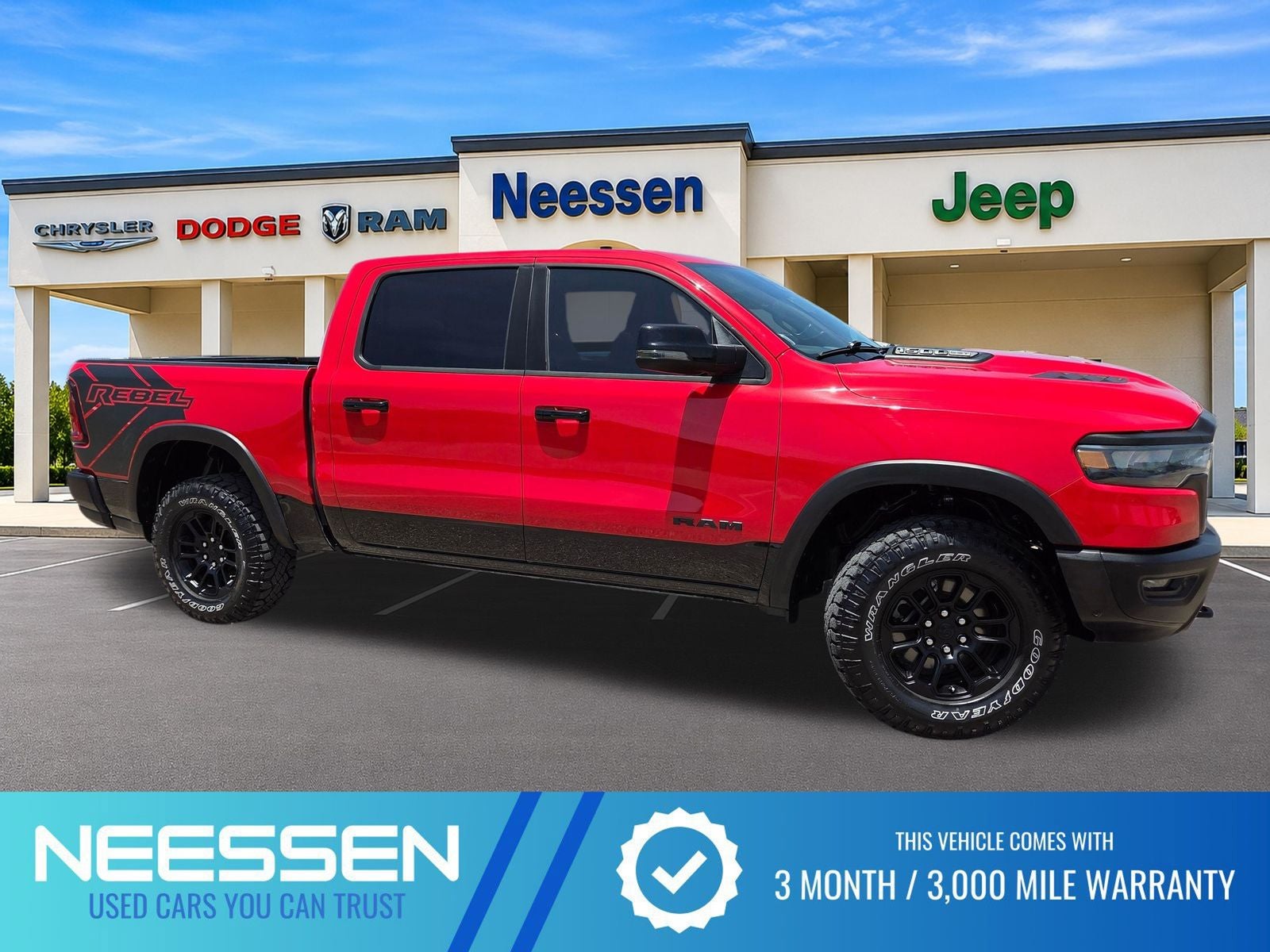 2025 RAM 1500 Rebel in Flame Red Clearcoat — front three-quarter view