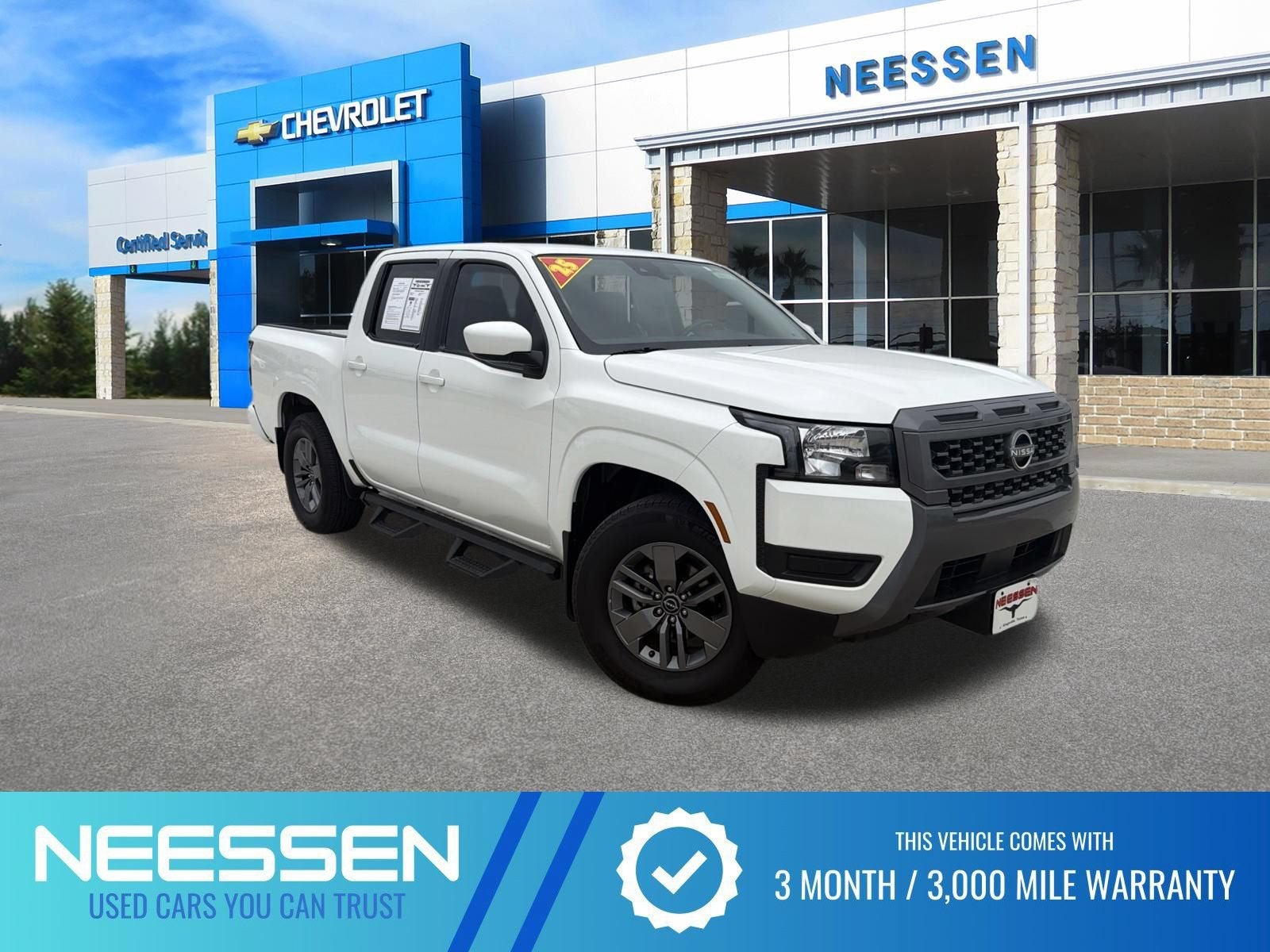 2025 Nissan Frontier SV in Glacier White — front three-quarter view