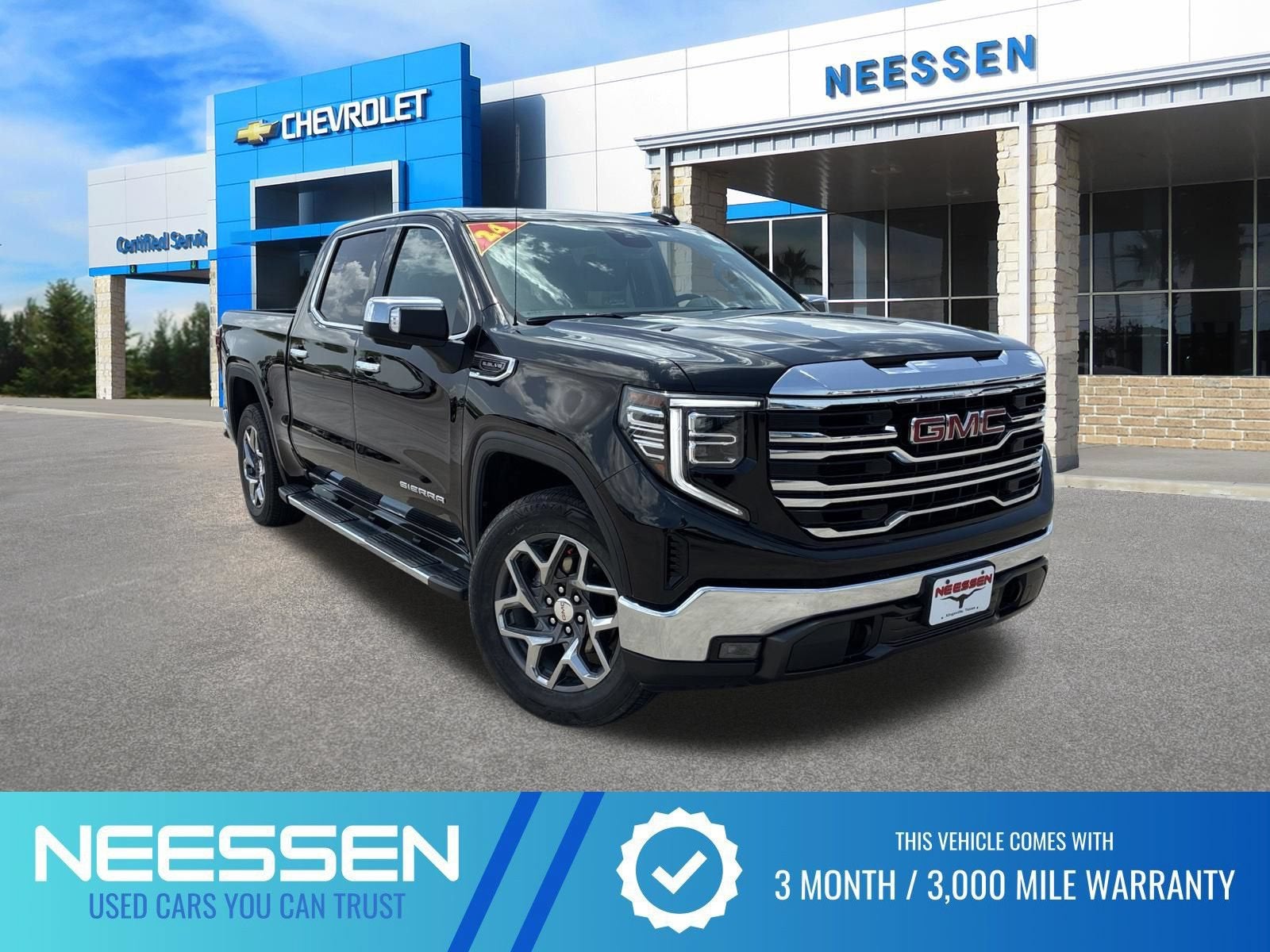 2024 GMC Sierra 1500 SLT in Onyx Black — front three-quarter view