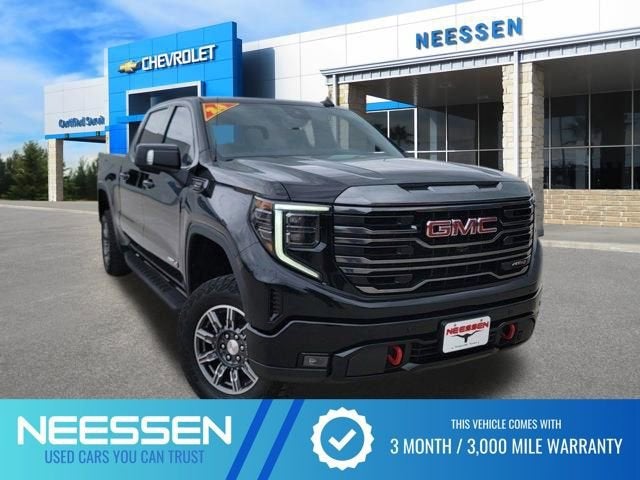 2024 GMC Sierra 1500 AT4 in Onyx Black — front three-quarter view